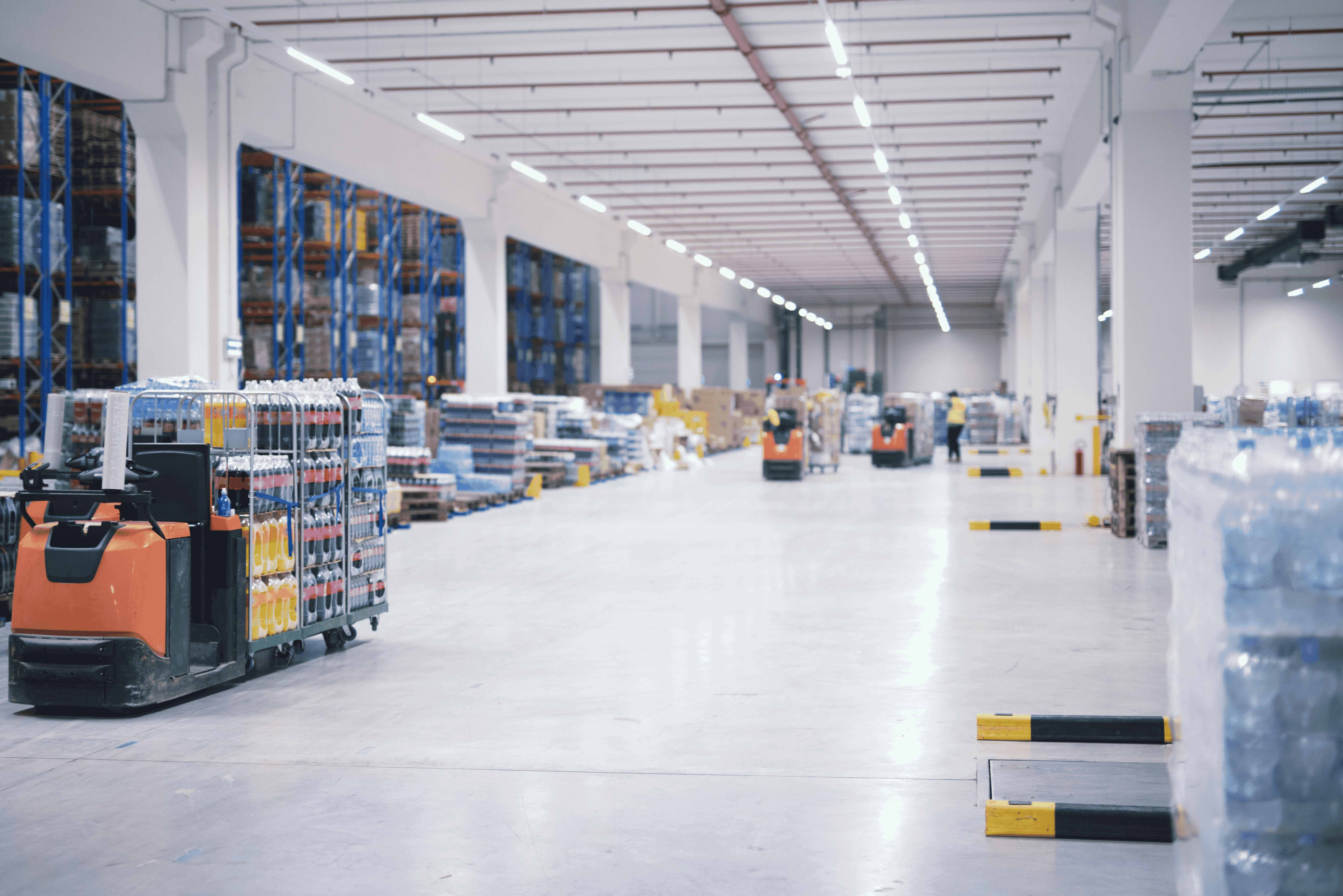 Modern automated warehouse with AGV robots and organized storage systems