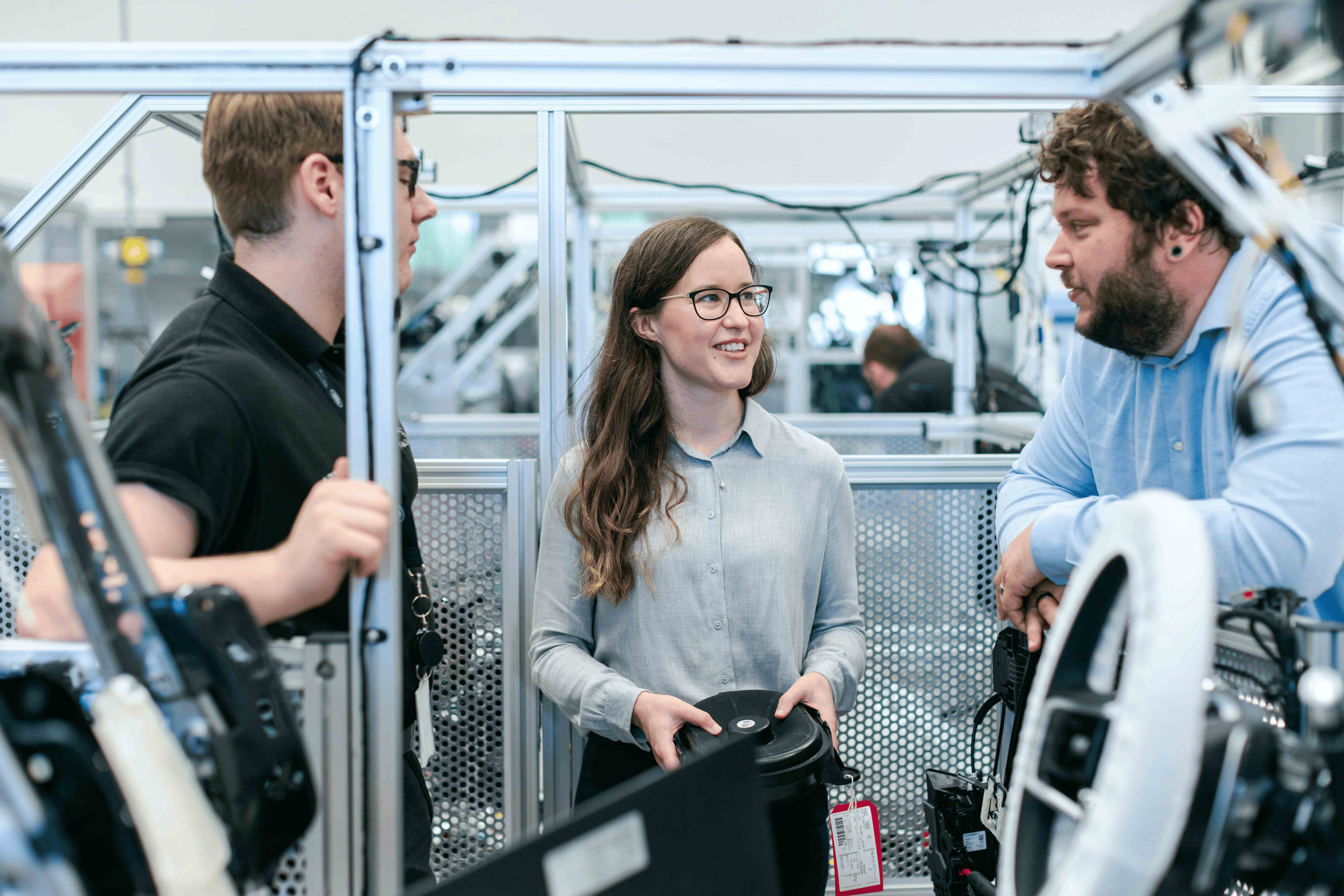 Team collaboration in modern warehouse with intelligent robotics technology